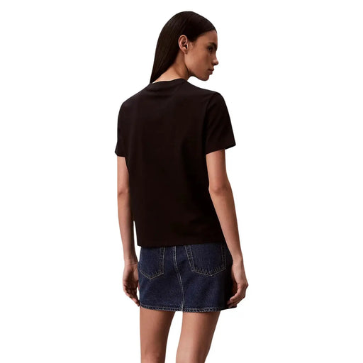 Black cotton short-sleeved Calvin Klein Jeans women t shirt with a simple round neck worn by a model
