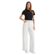 White wide-leg denim jeans paired with a Calvin Klein Jeans women black cotton round neck t shirt front view