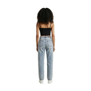Light-wash denim jeans with high-rise fit and straight-leg cut paired with calvin klein jeans women black cotton square neck top