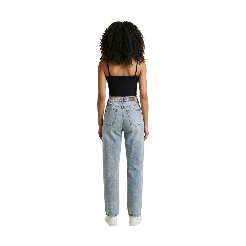 Light-wash denim jeans with high-rise fit and straight-leg cut paired with calvin klein jeans women black cotton square neck top