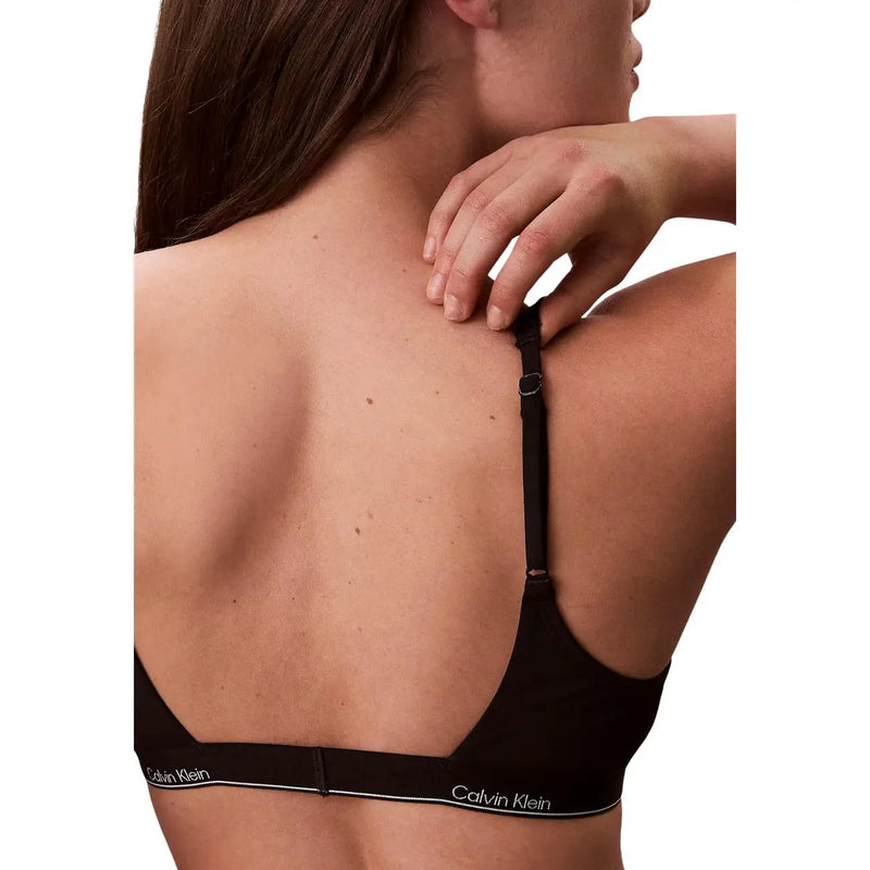 Calvin Klein Jeans women black halter bralette with sleek minimalist design and subtle white logo trim along the band