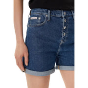 Dark blue cotton denim shorts with button-front closure rolled cuffs and Calvin Klein label on back pocket