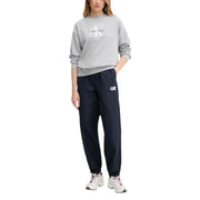 Calvin klein jeans women blue polyester trousers paired with a gray sweatshirt with white logo and navy joggers