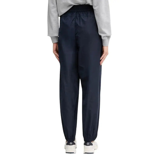 Calvin Klein Jeans women blue polyester trousers in dark navy sleek nylon with relaxed fit and elastic cuffs