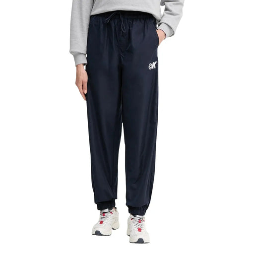 Navy blue polyester drawstring jogger pants with white logo on left thigh from Calvin Klein Jeans women collection