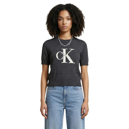 Dark gray short-sleeved cotton knit top with white ck logo across the chest by Calvin Klein Jeans women