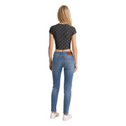 A pair of light-wash blue skinny jeans with brown leather belt loops shown with calvin klein jeans women grey cotton round neck t shirt