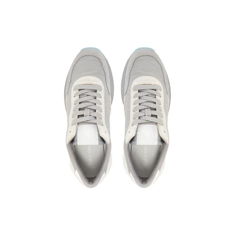 Calvin Klein Jeans women grey leather sneakers featuring sleek modern design in gray and white colors