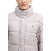 Calvin Klein Jeans light gray quilted puffer jacket with high collar and CK logo