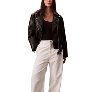 Black faux leather biker jacket with white stitching, wide collar, and belted hem