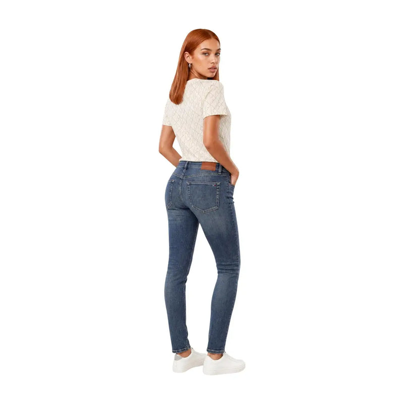 Blue denim jeans with slim fit and classic five-pocket design paired with calvin klein jeans women white cotton geometric t shirt