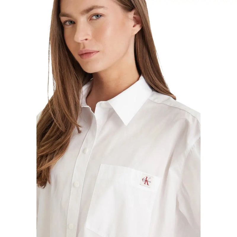 Calvin Klein Jeans women white cotton long classic button-down shirt with subtle red logo patch on chest pocket