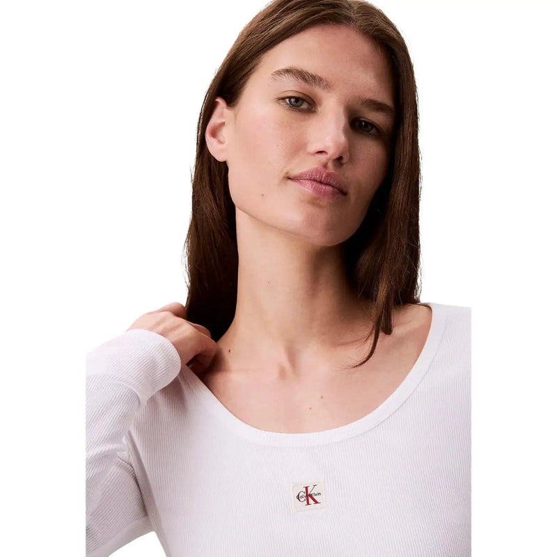 White ribbed long sleeve cotton lycra top with small embroidered Calvin Klein logo on the chest for women
