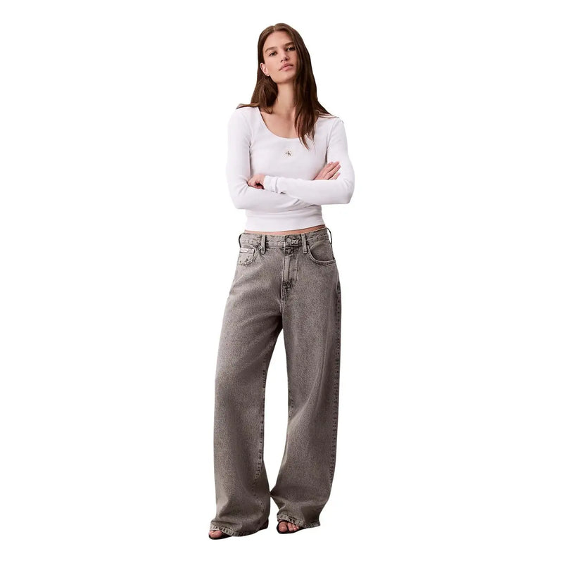 Wide-leg gray denim jeans with faded distressed finish and classic five-pocket design by calvin klein women