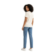 A woman wearing a calvin klein jeans women white cotton round neck short-sleeved t shirt with light-wash blue jeans