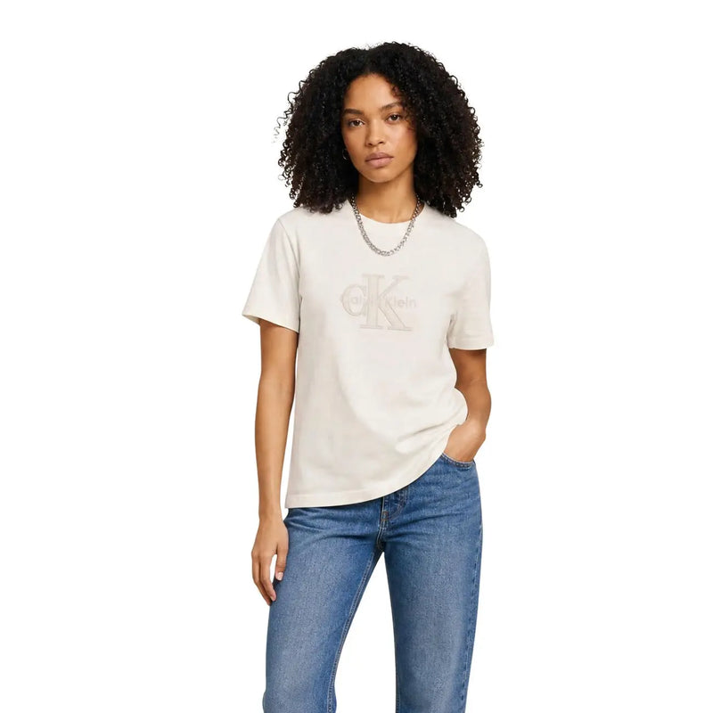 Cream-colored cotton Calvin Klein Jeans women t shirt with metallic ck logo and round neck design