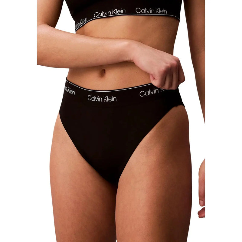 Black calvin klein high-waisted nylon briefs with white branding along the waistband for women beachwear