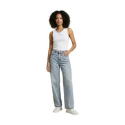 Calvin klein light-wash denim jeans with straight-leg cut and five-pocket design paired with white sleeveless top