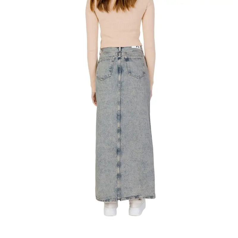 Calvin klein jeans women’s blue 100% cotton long denim skirt with straight cut and back pockets shown from the back