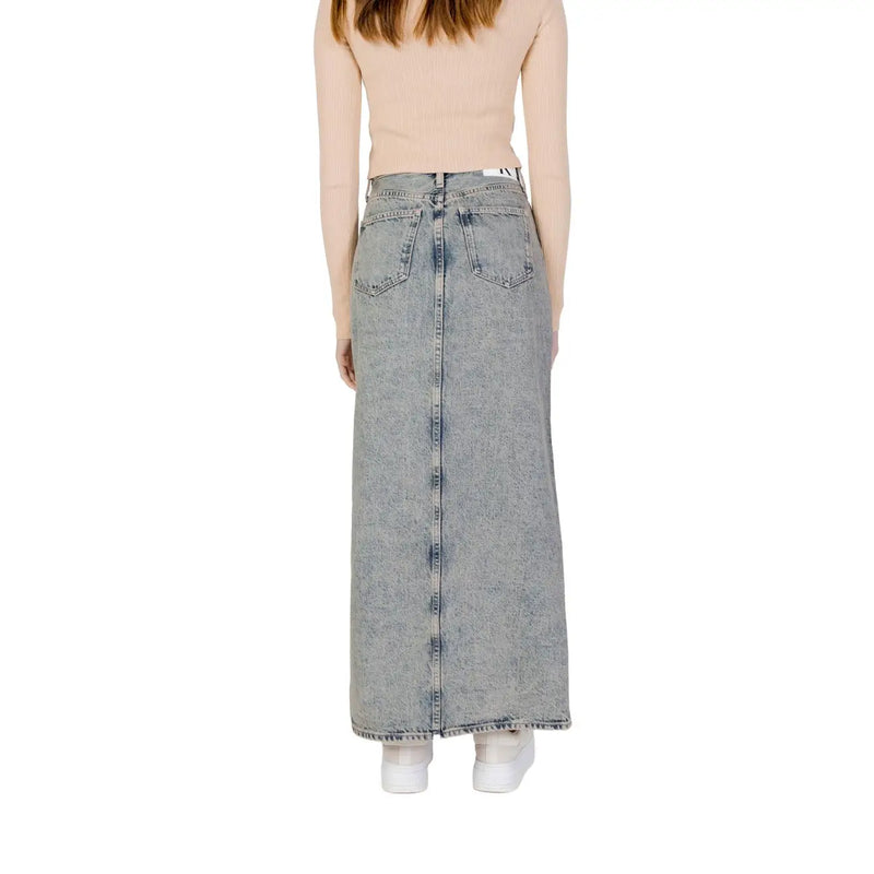 Calvin klein jeans women’s blue 100% cotton long denim skirt with straight cut and back pockets shown from the back