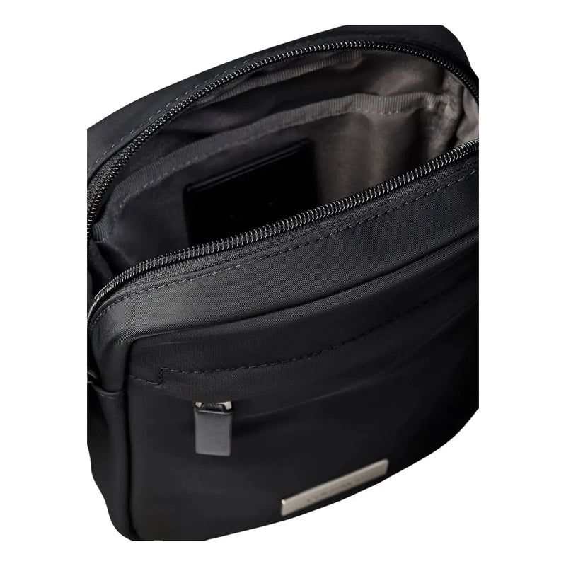 Calvin Klein men black nylon clean reporter bag with sleek minimalist design and silver-toned metal accents
