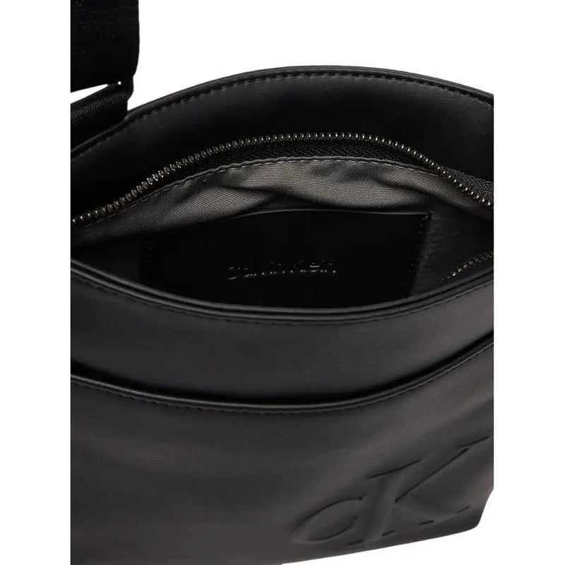 Calvin klein men black polyurethane crossbody shoulder bag with embossed logo and zipper-lined interior