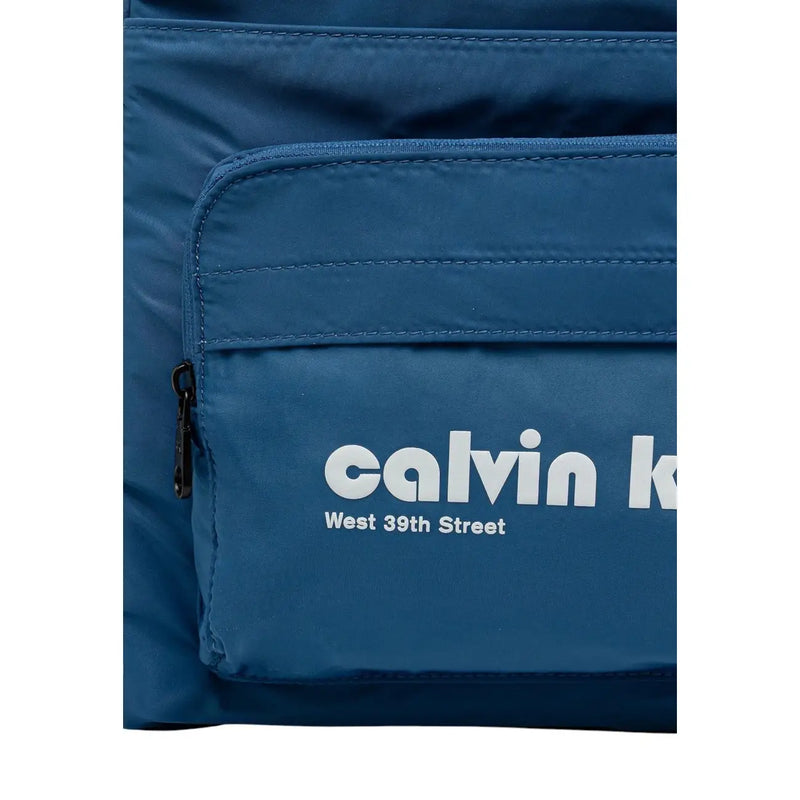 Blue calvin klein men rucksack with front pockets and white calvin klein and west 39th street branding 32x46x13 cm