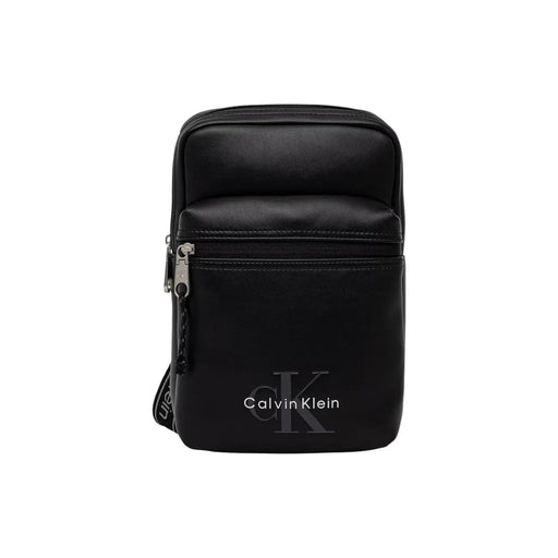 Black Calvin Klein men bold logo webbing sling bag with sleek minimalist design and subtle front logo in 17cm size