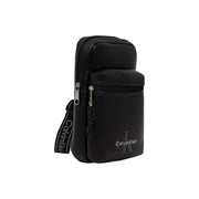 Calvin klein men bold logo webbing sling bag black with sleek minimalist design and silver-toned zippers