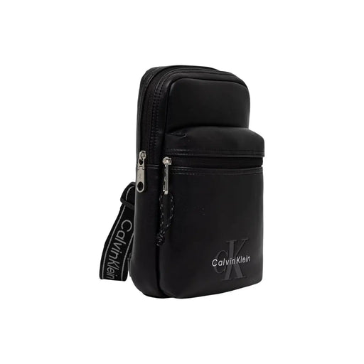 Calvin klein men bold logo webbing sling bag black with sleek minimalist design and silver-toned zippers