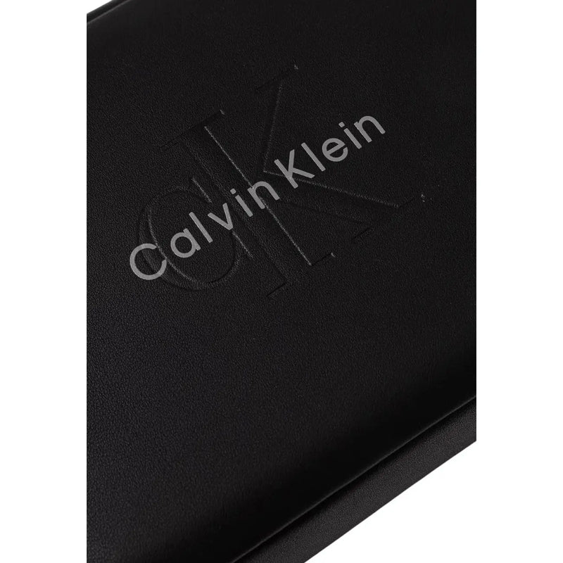Black calvin klein men bold pouch leather wallet with embossed logo in polyurethane measuring w22cm