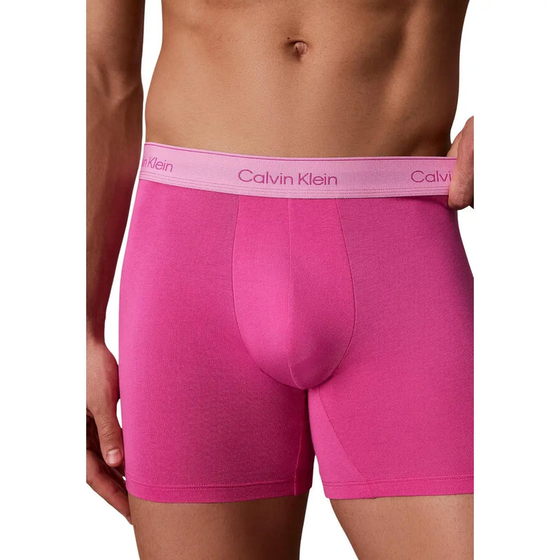 Leuchtendes Pink Calvin Klein Herren-Boxershorts mit passendem lavendelfarbenem Logo-Bund aus weicher Baumwolle, 5er-Packung