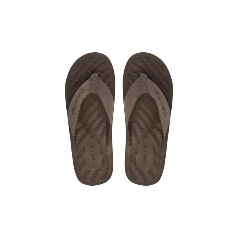 Calvin Klein men brown polyester flip-flops with textured sole and matching strap for casual wear