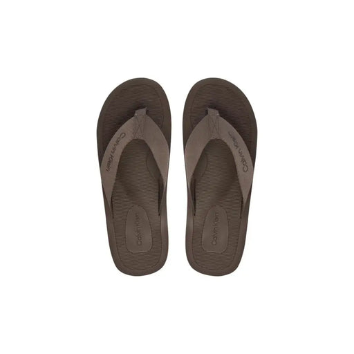 Calvin Klein men brown polyester flip-flops with textured sole and matching strap for casual wear