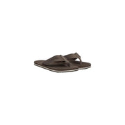Calvin Klein men brown polyester flip-flops with textured strap and white trim along the sole