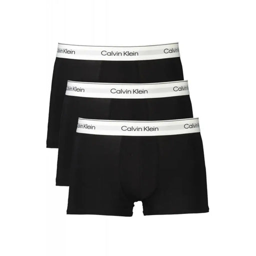 Three pairs of black men’s boxer briefs with white waistbands from Calvin Klein Men Cotton Elastane collection