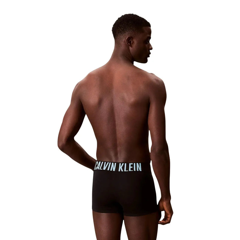 Black Calvin Klein men cotton trunks featuring a white logo waistband in a 3 pack set