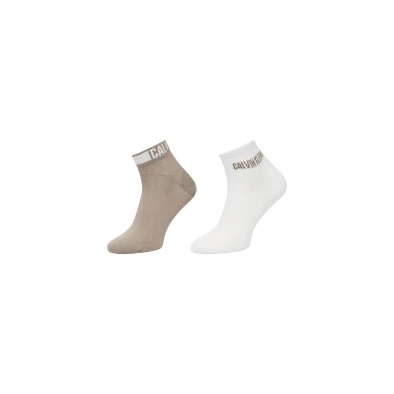 A pair of calvin klein men cotton ankle socks in beige and white with ribbed cuff and logo stripe