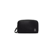 Calvin Klein men emblem black dopp kit bag made of textured leather with zipper closure and metallic logo tag