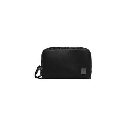 Calvin Klein men emblem black dopp kit bag made of textured leather with zipper closure and metallic logo tag
