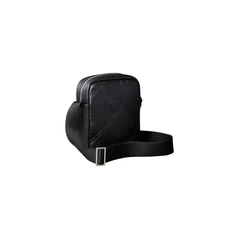 Calvin Klein men emblem reporter bag in black leather with embossed logo pattern and silver toned buckle