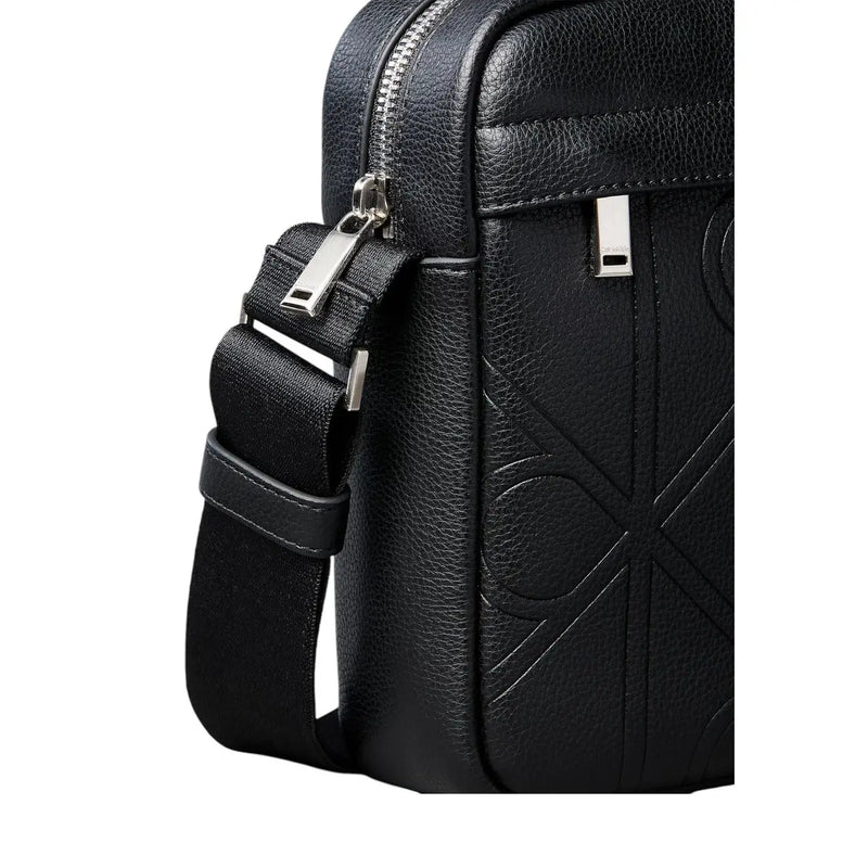 Calvin Klein men emblem reporter bag in black leather with embossed geometric pattern and silver-toned hardware
