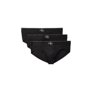 Black Calvin Klein men’s briefs with sleek minimalist design and subtle white logo on waistband for everyday wear