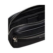 Calvin Klein men perforated black crossbody bag made of polyurethane with silver zippers and compact design