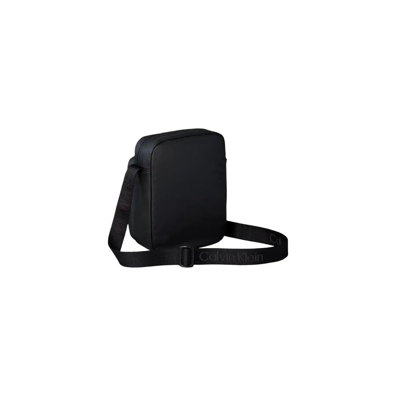 Black Calvin Klein men puffer utility reporter crossbody bag with sleek minimalist design and textured fabric size W16