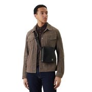 Calvin Klein men shoulder bag in black polyurethane with minimalist design and subtle front logo, measuring 17x21x7 cm