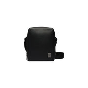 Black textured leather calvin klein men shoulder bag with sleek minimalist design and subtle front brand patch