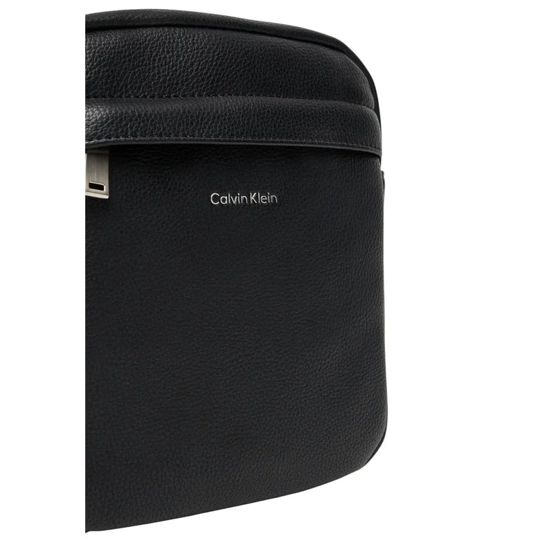 Calvin Klein men shoulder bag in black leather with silver-tone hardware and zip pockets 18x23x7 cm