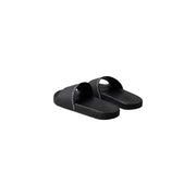 Black calvin klein men slippers open toe slide sandals in polyurethane with minimalist design and subtle white branding