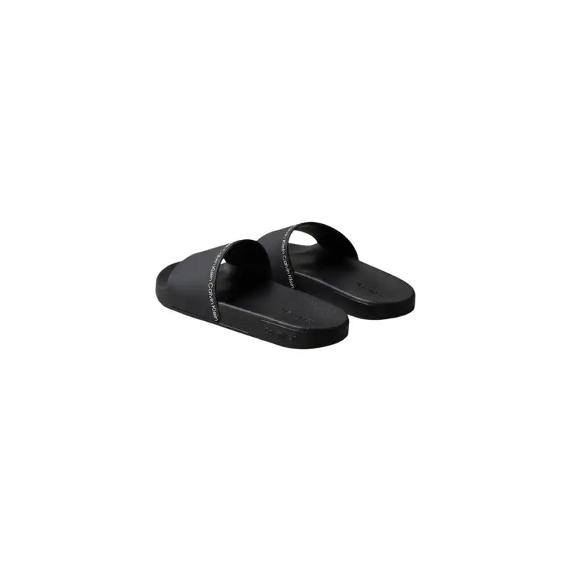 Black calvin klein men slippers open toe slide sandals in polyurethane with minimalist design and subtle white branding